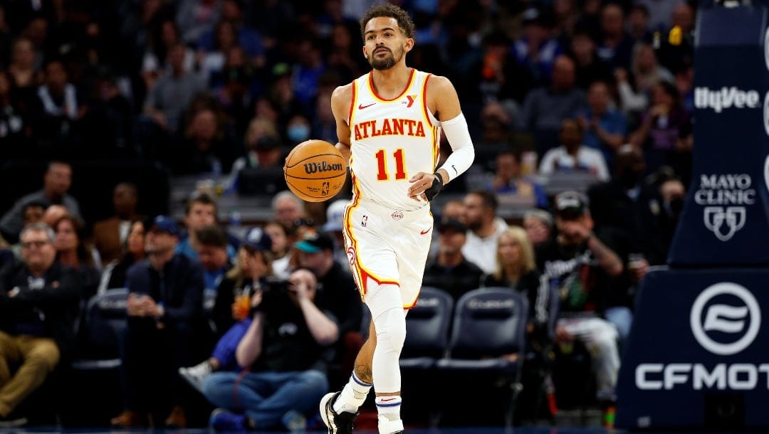 Trae Young #11 of the Atlanta Hawks dribbles the ball against the Minnesota Timberwolves in the first quarter at Target Center on April 12, 2024 in Minneapolis, Minnesota.