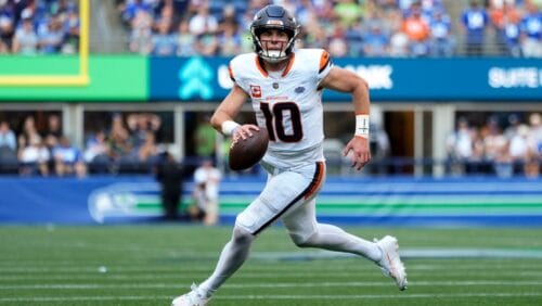 Denver Broncos quarterback Bo Nix (10) runs for a touchdown during the second half of an NFL football game against the Seattle Seahawks, Sunday, Sept. 8, 2024, in Seattle.