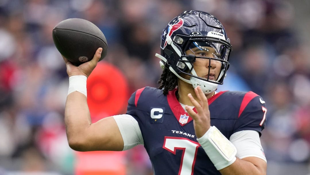 Houston Texans quarterback C.J. Stroud (7) looks to throw a pass during the first half of an NFL football game against the Tennessee Titans, Sunday, Dec. 31, 2023, in Houston. (AP Photo/Eric Christian Smith)