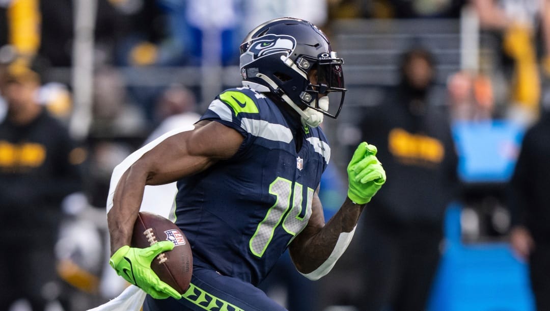 Seattle Seahawks wide receiver DK Metcalf runs with the ball after making a reception during an NFL football game against the Pittsburgh Steelers, Sunday, Dec. 31, 2023, in Seattle. The Steelers won 30-23. (AP Photo/Stephen Brashear)