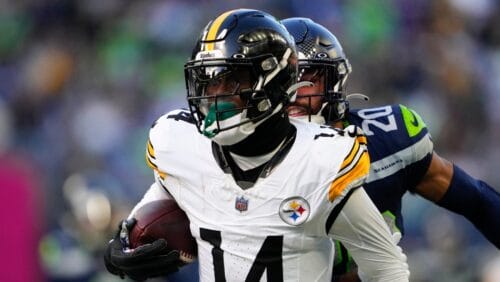 Pittsburgh Steelers wide receiver George Pickens (14) runs the ball in front of Seattle Seahawks safety Julian Love, back, during the first half of an NFL football game Sunday, Dec. 31, 2023, in Seattle. The Steelers won 30-23. (AP Photo/Lindsey Wasson)