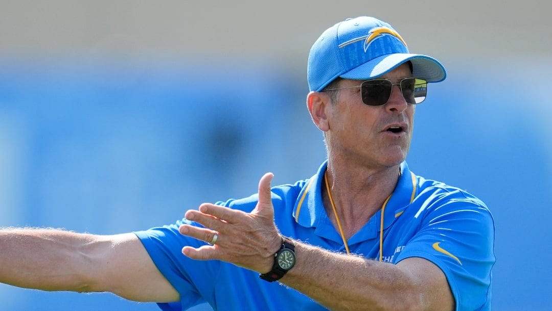 Los Angeles Chargers head coach Jim Harbaugh instructs on the field during NFL football training camp Wednesday, July 24, 2024, in El Segundo, Calif. (AP Photo/Marcio Jose Sanchez)