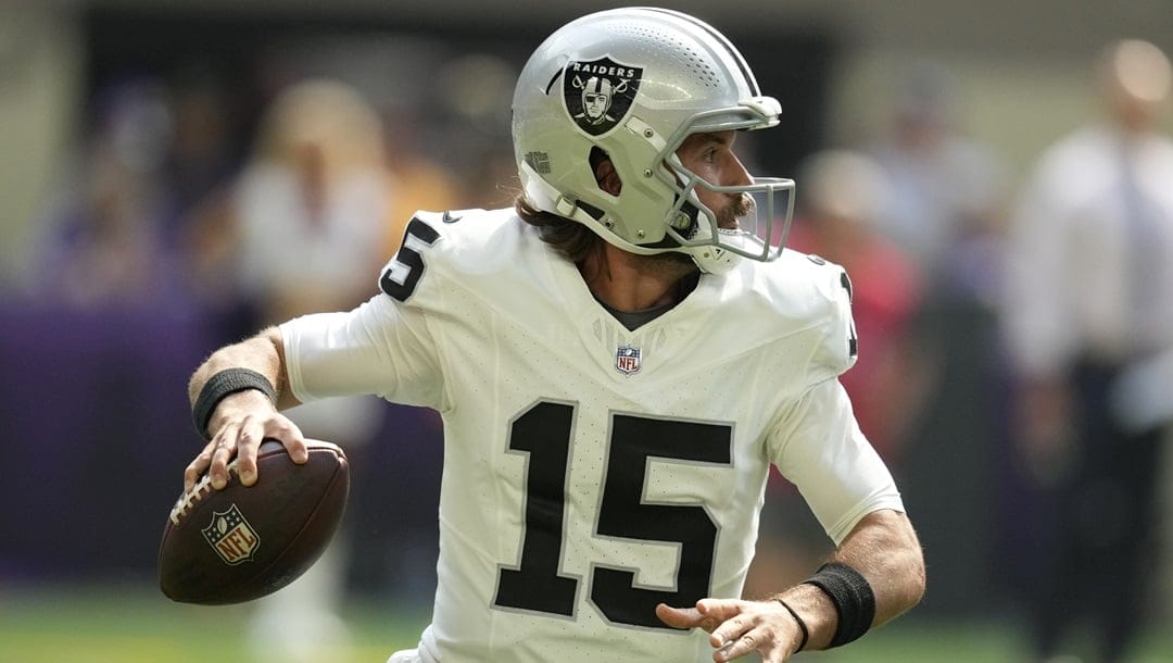 Las Vegas Raiders quarterback Gardner Minshew II (15) looks to pass during the first half of an NFL preseason football game against the Minnesota Vikings, Saturday, Aug. 10, 2024, in Minneapolis.