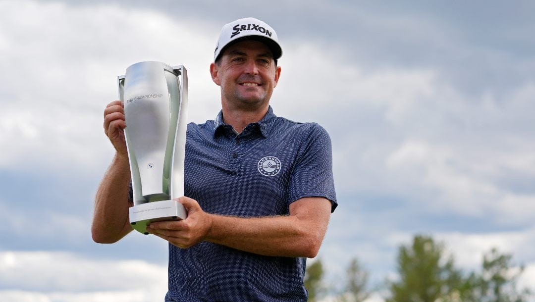 Keegan Bradley holds up the BMW Championship trophy after winning the BMW Championship golf event at Castle Pines Golf Club, Sunday, Aug. 25, 2024, in Castle Rock, Colo.