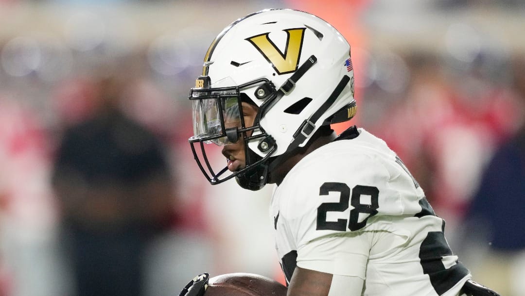 Vanderbilt running back Sedrick Alexander (28) runs for a short yardage gain against Mississippi during the first half of an NCAA college football game in Oxford, Miss., Saturday, Oct. 28, 2023. Mississippi won 33-7. (AP Photo/Rogelio V. Solis)