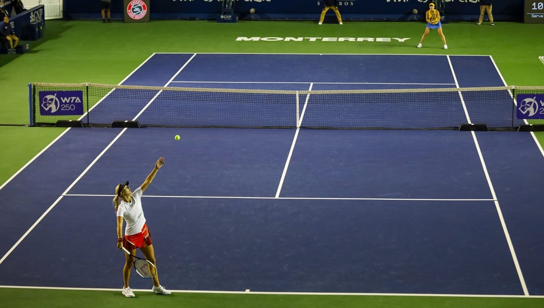 Anastasia Potapova of Russia, below, serves a ball as she plays against Elina Svitolina of Ukraine during their match at the Abierto de Monterrey tennis tournament in Monterrey, Mexico, Tuesday, March 1, 2022.