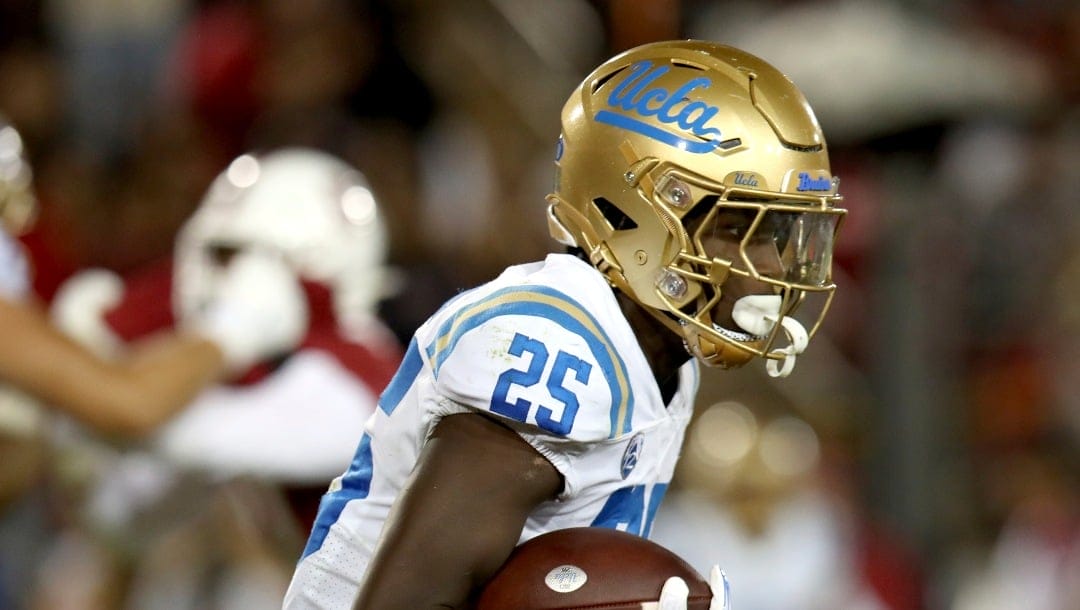 UCLA running back TJ Harden (25) runs during an NCAA college football game against Stanford, Saturday, Oct. 21, 2023, in Stanford, Calif. (AP Photo/Scot Tucker)