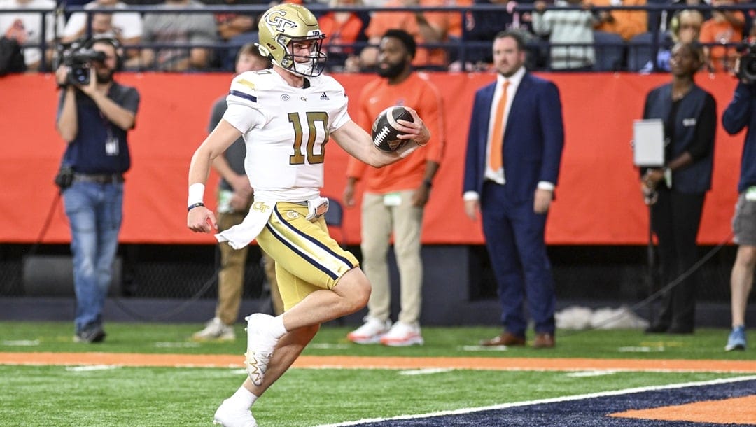 Georgia Tech quarterback Haynes King (10) runs for a touchdown against Syracuse during the first half of an NCAA football game on Saturday, Sept. 7, 2024 in Syracuse, N.Y.