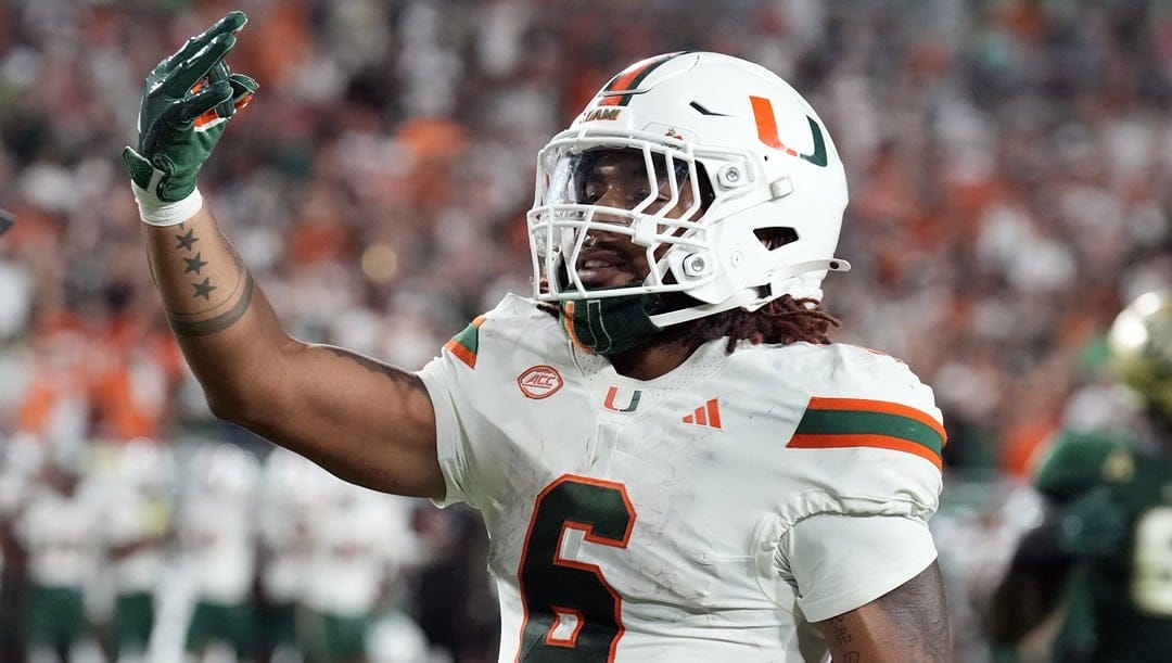 Miami running back Damien Martinez celebrates after scoring against South Florida during the second half of an NCAA college football game Saturday, Sept. 21, 2024, in Tampa, Fla.