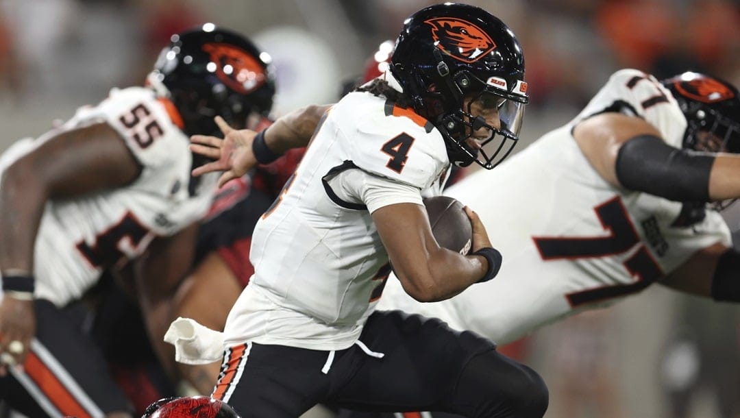 Oregon State quarterback Gevani McCoy (4) scrambles out of the pocket against San Diego State during the second half of an NCAA college football game Saturday, Sept. 7, 2024, in San Diego. Oregon State won 21-0.