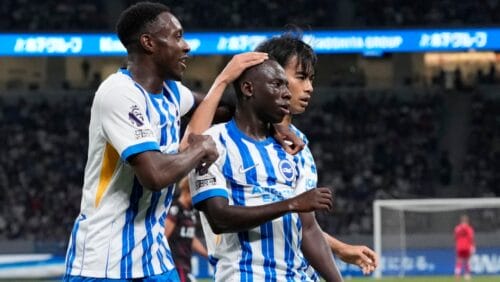 Brighton's Yankuba Minteh, center, celebrates with teammates incuding Kaoru Mitoma after scoring a goal during a friendly soccer match agains Kashima Antlers in Tokyo, Wednesday, July 24, 2024.