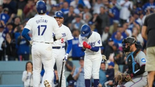 Los Angeles Dodgers two-way player Shohei Ohtani (17) celebrates with Freddie Freeman (5) and Mookie Betts, right, after hitting a home run during the first inning of a baseball game against the Miami Marlins in Los Angeles, Monday, May 6, 2024.