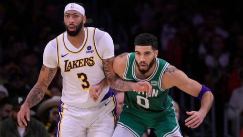 Anthony Davis #3 of the Los Angeles Lakers and Jayson Tatum #0 of the Boston Celtics battle for position on the court at Crypto.com Arena on December 25, 2023 in Los Angeles, California.