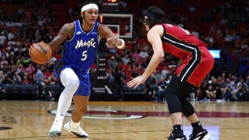 Paolo Banchero #5 of the Orlando Magic drives against Jaime Jaquez Jr. #11 of the Miami Heat during the first quarter of the game at Kaseya Center on January 12, 2024 in Miami, Florida.