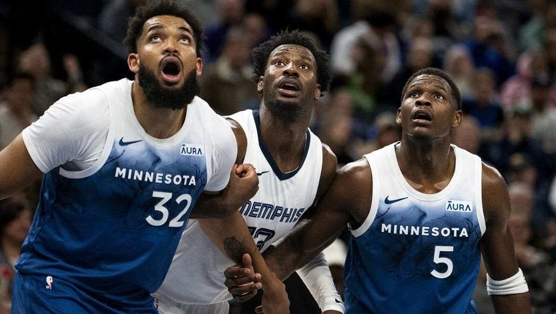 MINNEAPOLIS, MINNESOTA - FEBRUARY 28: Jaren Jackson Jr. #13 of the Memphis Grizzlies, Karl-Anthony Towns #32 and Anthony Edwards #5 of the Minnesota Timberwolves battle for position in the third quarter of the game at Target Center on February 28, 2024 in Minneapolis, Minnesota.