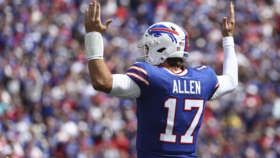 Buffalo Bills quarterback Josh Allen (17) signals touchdown during the first half of an NFL football game against the Arizona Cardinals in Orchard Park N.Y., Sunday Sept. 8, 2024.