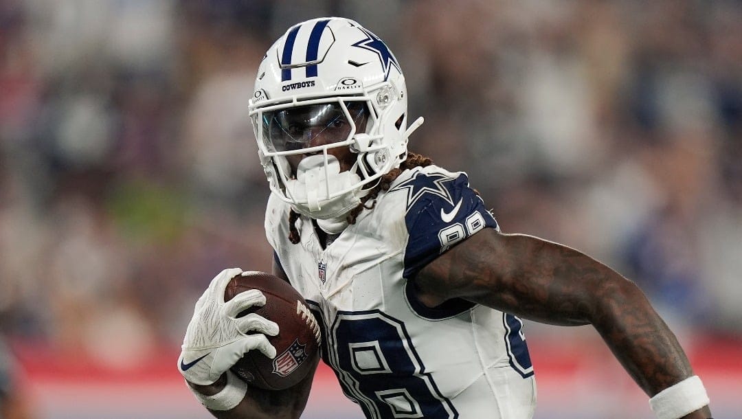 Dallas Cowboys wide receiver CeeDee Lamb (88) runs for a touchdown against the New York Giants during the second quarter of an NFL football game, Thursday, Sept. 26, 2024, in East Rutherford, N.J.