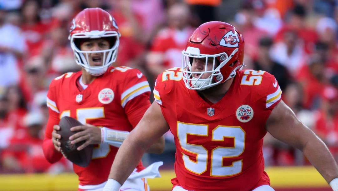 Kansas City Chiefs center Creed Humphrey (52) protects Kansas City Chiefs quarterback Patrick Mahomes (15) during the first half of an NFL football game against the Cincinnati Bengals, Sunday, Sept. 15, 2024 in Kansas City, Mo. The Chiefs defeated the Bengals, 26-25. (AP Photo/Reed Hoffmann)