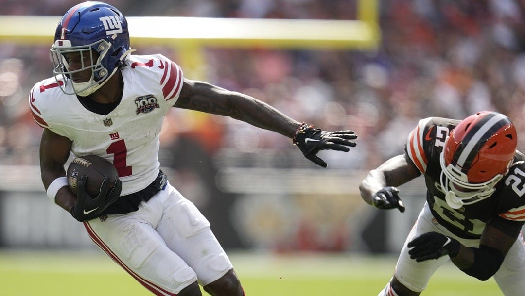 New York Giants wide receiver Malik Nabers (1) runs against Cleveland Browns cornerback Denzel Ward (21) during the second half of an NFL football game, Sunday, Sept. 22, 2024, in Cleveland.