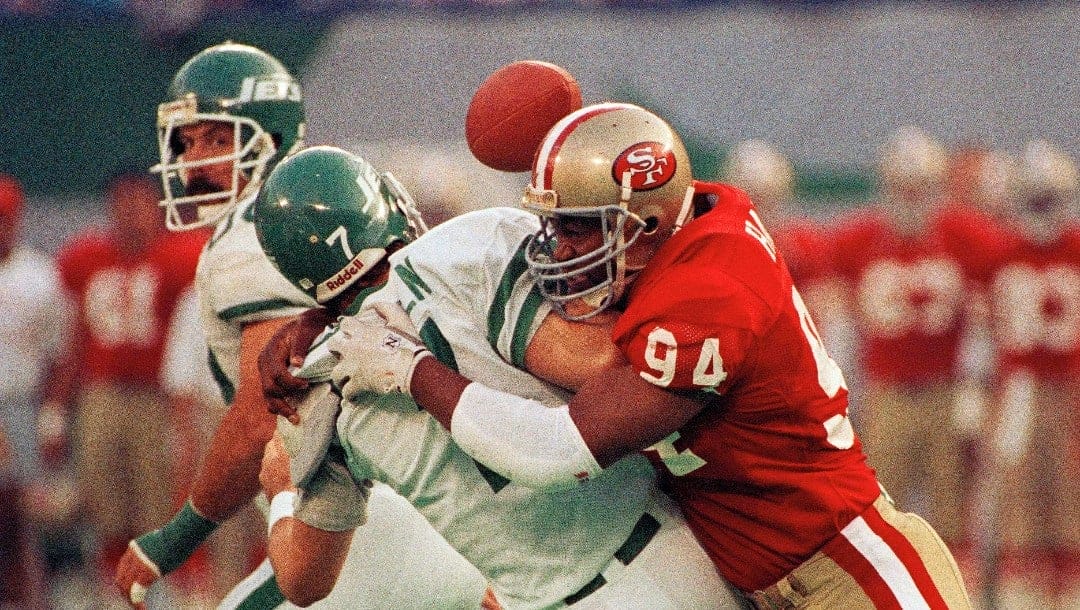 FILE - In this Oct. 29, 1989, file photo, New York Jets quarterback Ken O'Brien is sacked by San Francisco 49ers' Charles Haley in the first quarter of play in East Rutherford, N.J. Haley will be inducted into the Pro Football Hall of Fame this weekend in Canton, Ohio.