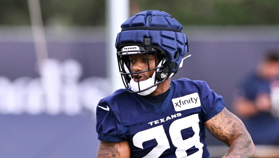 Houston Texans running back Joe Mixon (28) participates in a drill during NFL football training camp, Friday, July 19, 2024, Houston. (AP Photo/Maria Lysaker)