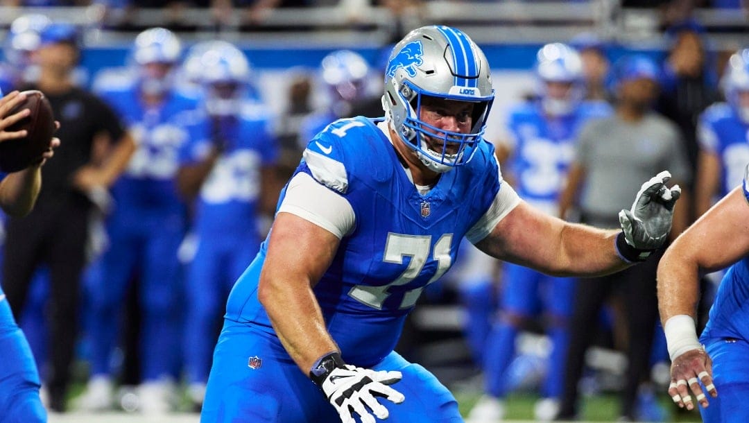 Detroit Lions guard Kevin Zeitler (71) blocks on offense against the Los Angeles Rams during an NFL football game in Detroit, Sunday, Sept. 8, 2024. (AP Photo/Rick Osentoski)