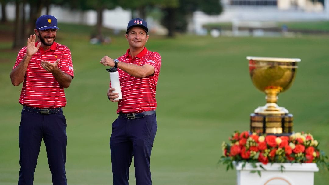 Kevin Kisner, right, and Max Homa celebrate a win over the International team in match play at the Presidents Cup golf tournament at the Quail Hollow Club, Sunday, Sept. 25, 2022, in Charlotte, N.C. Kisner stopped playing in June to work on his game and spend more time with family. He returns to the PGA Tour this week.