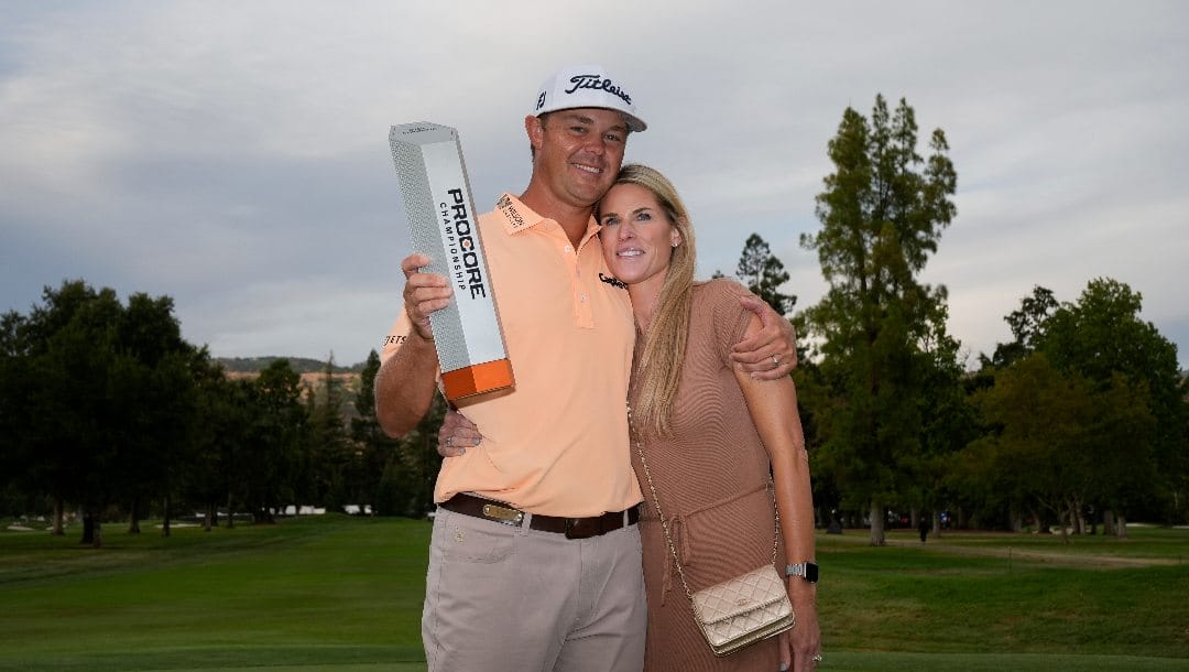 Patton Kizzire, left, is poses with his wife Kari Elizabeth Hodgdon after winning the Procore Championship golf tournament at Silverado Resort North Course, Sunday, Sept. 15, 2024, in Napa, Calif.