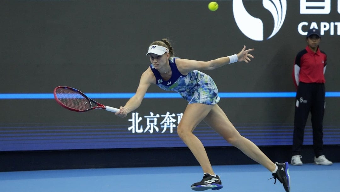 Elena Rybakina of Kazakhstan returns a shot to Liudmila Samsanova of Russia during the women's singles semifinal match in the China Open tennis tournament at the Diamond Court in Beijing, Saturday, Oct. 7, 2023.