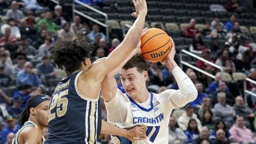 Creighton's Ryan Kalkbrenner (11) drives against Akron's Enrique Freeman (25) during the second half of a first-round college basketball game in the NCAA Tournament Thursday, March 21, 2024, in Pittsburgh.