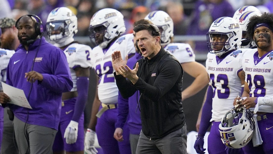 James Madison head football coach Bob Chesney, center, reacts during the second half of the Armed Forces Bowl NCAA college football game against Air Force, Saturday, Dec. 23, 2023, in Fort Worth, Texas. Air Force won 31-21.