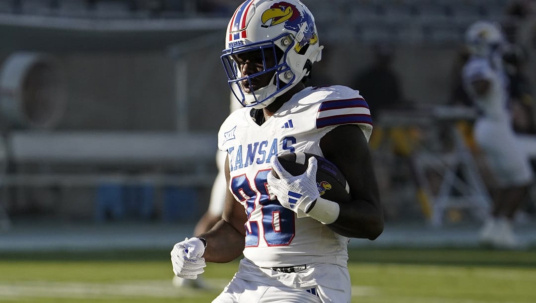 Kansas Jayhawks running back Sevion Morrison (28) warms up before their game against the Arizona State Sun Devils during a NCAA college football game Saturday, Oct. 5, 2024, in Tempe, Ariz.