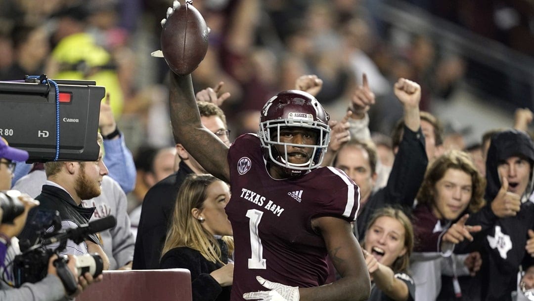 Texas A&M wide receiver Quartney Davis (1) celebrates after catching a touchdown pass during the seventh overtime of an NCAA college football game against LSU, in College Station, Texas. Texas A&M won 74-72.