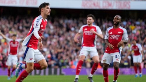 Arsenal's Kai Havertz, left, celebrates after scoring his side's opening goal during the English Premier League soccer match between Arsenal and Southampton at the Emirates Stadium in London, Saturday, Oct. 5, 2024.