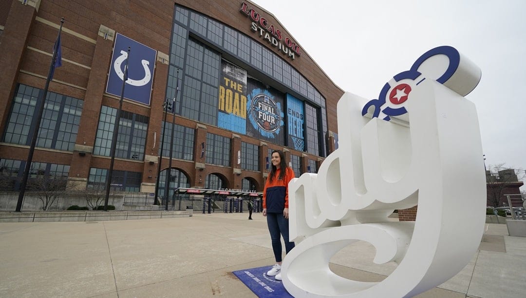 Regan O'Brien poses for a photo outside of Lucas Oil Stadium before an NCAA college basketball championship game between Illinois and Ohio State at the Big Ten Conference tournament, Sunday, March 14, 2021, in Indianapolis.