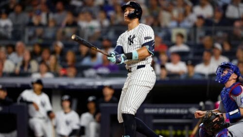 New York Yankees' Aaron Judge watches the ball go into the stands for a home run against the Los Angeles Dodgers during the eighth inning of a baseball game, Sunday, June 9, 2024, in New York.