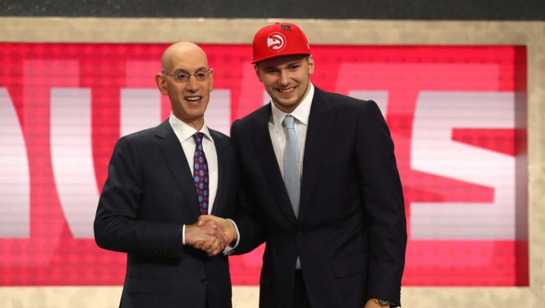 NEW YORK, NY - JUNE 21: Luka Doncic poses with NBA Commissioner Adam Silver after being drafted third overall by the Atlanta Hawks during the 2018 NBA Draft at the Barclays Center on June 21, 2018 in the Brooklyn borough of New York City. NOTE TO USER: User expressly acknowledges and agrees that, by downloading and or using this photograph, User is consenting to the terms and conditions of the Getty Images License Agreement.