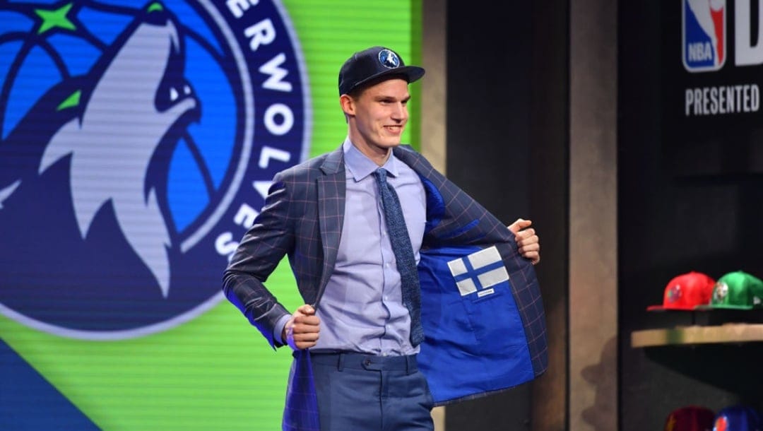 BROOKLYN, NY - JUNE 22: Lauri Markkanen shows off his jacket after being selected seventh overall by the Minnesota Timberwolves at the 2017 NBA Draft on June 22, 2017 at Barclays Center in Brooklyn, New York. NOTE TO USER: User expressly acknowledges and agrees that, by downloading and or using this photograph, User is consenting to the terms and conditions of the Getty Images License Agreement. Mandatory Copyright Notice: Copyright 2017 NBAE (Photo by Jesse D. Garrabrant/NBAE via Getty Images)