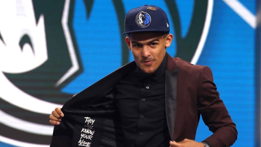 NEW YORK, NY - JUNE 21: Trae Young reacts after being drafted fifth overall by the Dallas Mavericks during the 2018 NBA Draft at the Barclays Center on June 21, 2018 in the Brooklyn borough of New York City. NOTE TO USER: User expressly acknowledges and agrees that, by downloading and or using this photograph, User is consenting to the terms and conditions of the Getty Images License Agreement.