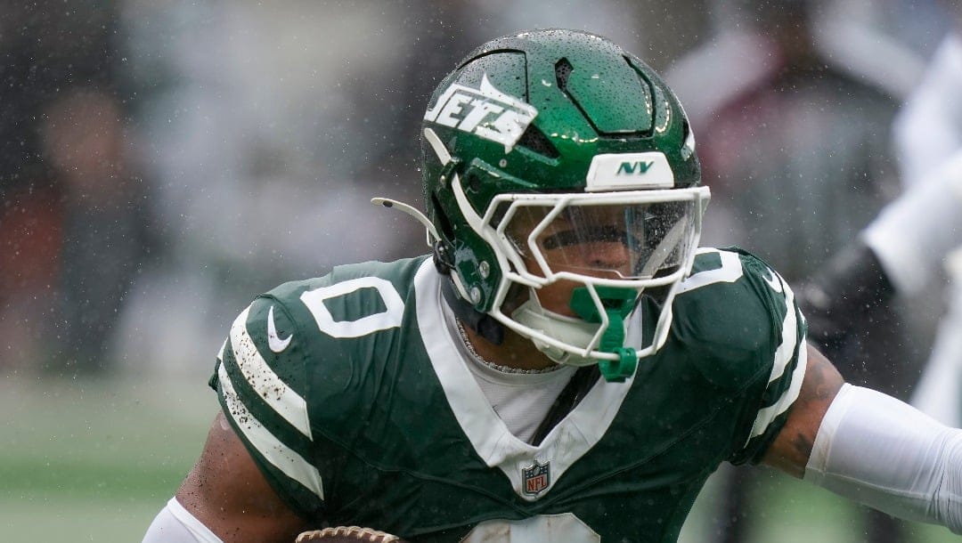 New York Jets running back Braelon Allen (0) carries the ball against the Denver Broncos during the first quarter of an NFL football game, Sunday, Sept. 29, 2024, in East Rutherford, N.J. (AP Photo/Seth Wenig)