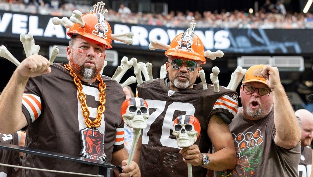 Cleveland Browns fans watch the Browns play the Las Vegas Raiders in an NFL football game, Sunday, Sept. 29, 2024, in Las Vegas, Nev. (AP Photo/Jeff Lewis)