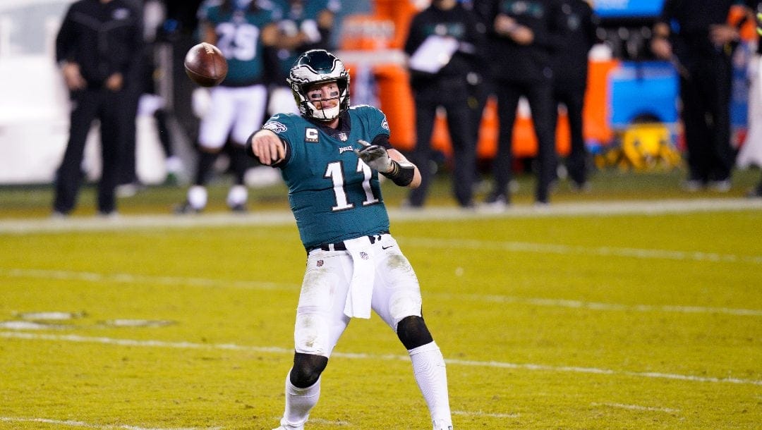 Philadelphia Eagles' Carson Wentz looks to pass during the second half of an NFL football game against the Seattle Seahawks, Monday, Nov. 30, 2020, in Philadelphia.