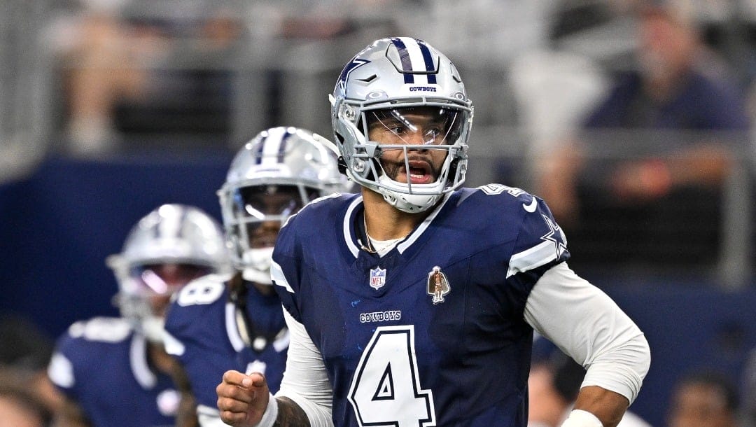 Dallas Cowboys quarterback Dak Prescott (4) runs on to the field with the offense during an NFL football game against the Detroit Lions in Arlington, Texas, Sunday, Oct. 13, 2024. (AP Photo/Jerome Miron)