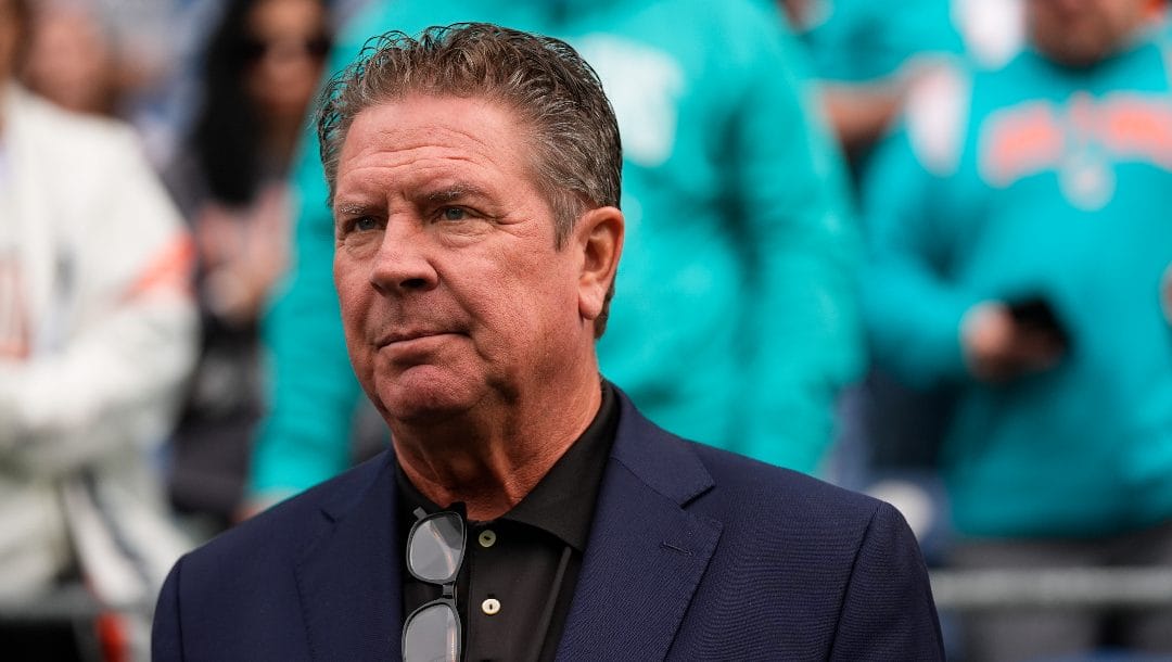 Former Miami Dolphins quarterback Dan Marino walks on the sideline before an NFL football game between the Seattle Seahawks and the Miami Dolphins, Sunday, Sept. 22, 2024 in Seattle.