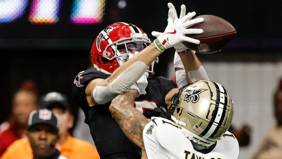 New Orleans Saints cornerback Alontae Taylor (1) breaks up a pass intended for Atlanta Falcons wide receiver Drake London (5) during the first half of an NFL football game, Sunday, Sept. 29, 2024, in Atlanta. (AP Photo/Butch Dill)