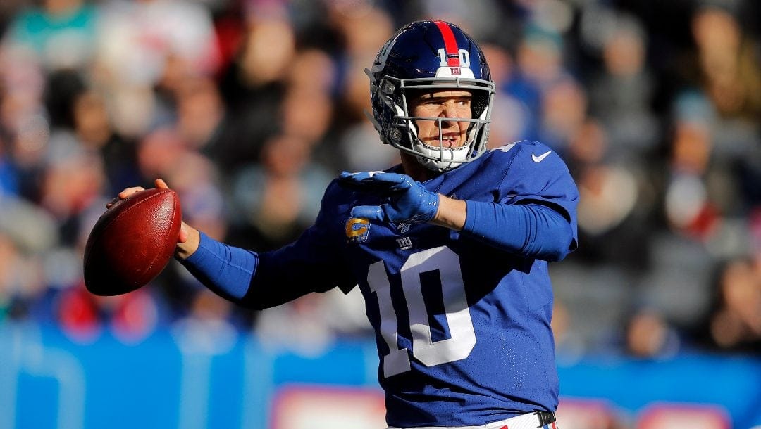 In this Dec. 15, 2019, file photo, New York Giants quarterback Eli Manning looks to pass in the first half of an NFL football game against the Miami Dolphins in East Rutherford, N.J.