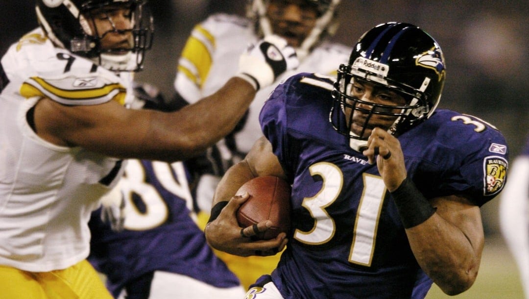 Baltimore Ravens running back Jamal Lewis (31) eludes Pittsburgh Steelers linebacker Kendrell Bell (97) on a 25-yard touchdown run in the first quarter Sunday, Dec. 28, 2003, in Baltimore.