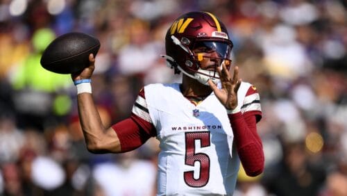 Washington Commanders quarterback Jayden Daniels (5) in action during the first half of an NFL football game against the Baltimore Ravens, Sunday, Oct. 13, 2024, in Baltimore.