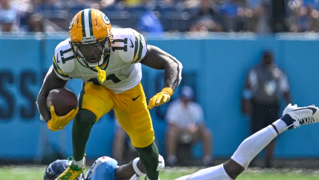 Green Bay Packers' Jayden Reed tries to get past Tennessee Titans' Roger McCreary after a catch during the second half of an NFL football game Sunday, Sept. 22, 2024, in Nashville, Tenn. (AP Photo/John Amis)