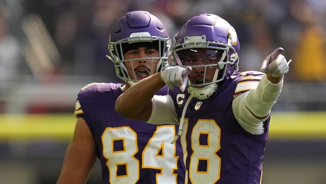 Minnesota Vikings wide receiver Justin Jefferson (18) celebrates after catching a pass for a first down during the first half of an NFL football game against the Houston Texans, Sunday, Sept. 22, 2024, in Minneapolis. (AP Photo/Abbie Parr)